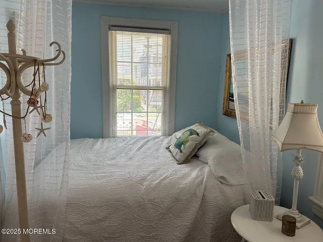 a utility room with stainless steel appliances kitchen island granite countertop a sink dishwasher and a dining table with chairs