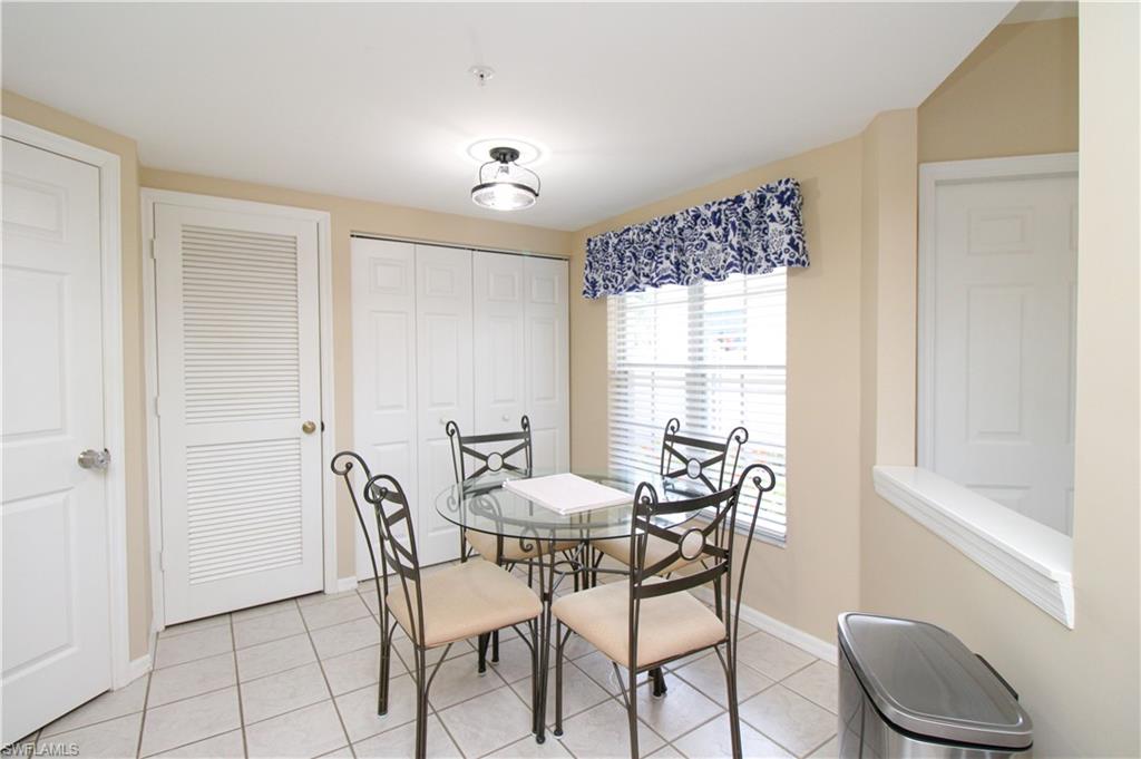 5025 Cedar Springs Drive, Unit 102 Naples, FL 34110 - Photo 26 of 50 View of tiled dining space