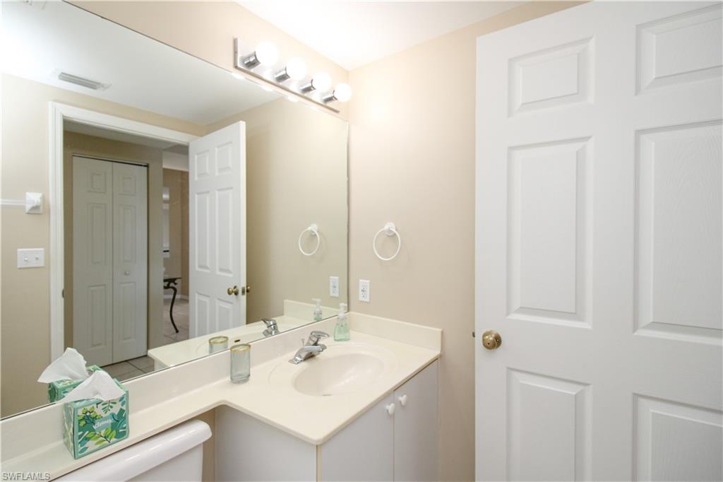 5025 Cedar Springs Drive, Unit 102 Naples, FL 34110 - Photo 32 of 50 Bathroom featuring vanity
