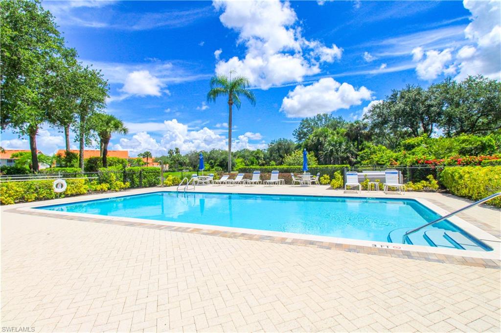 5025 Cedar Springs Drive, Unit 102 Naples, FL 34110 - Photo 44 of 50 View of pool featuring a patio