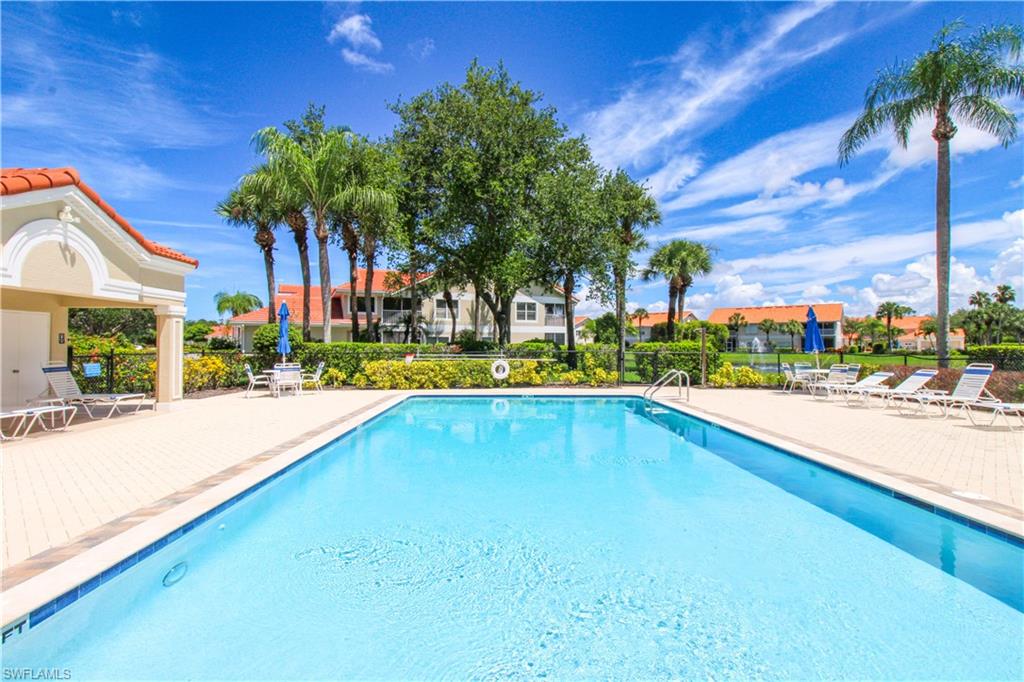 5025 Cedar Springs Drive, Unit 102 Naples, FL 34110 - Photo 47 of 50 View of swimming pool featuring a patio