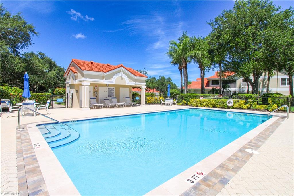 5025 Cedar Springs Drive, Unit 102 Naples, FL 34110 - Photo 48 of 50 View of swimming pool with a patio area