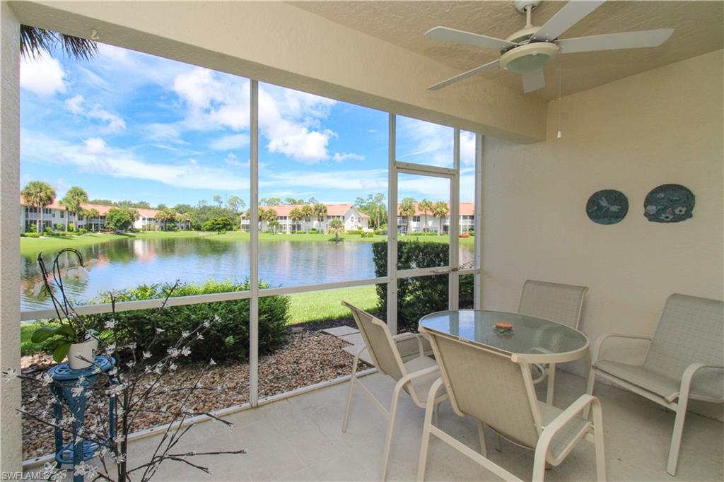5025 Cedar Springs Drive, Unit 102 Naples, FL 34110 - Photo 5 of 50 Sunroom with a water view and ceiling fan