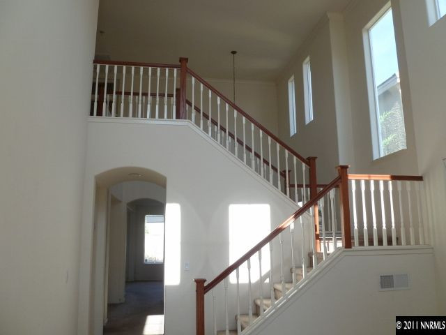 9265 Hummer Drive Reno, NV 89521 - Photo 3 of 13 a view of staircase with railing and a window