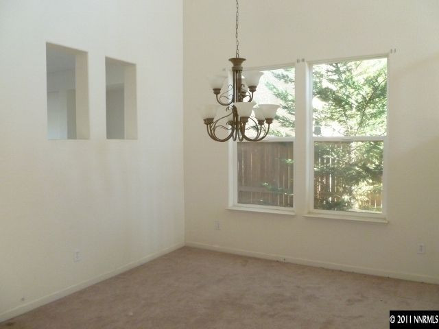 9265 Hummer Drive Reno, NV 89521 - Photo 4 of 13 a view of an empty room with a window