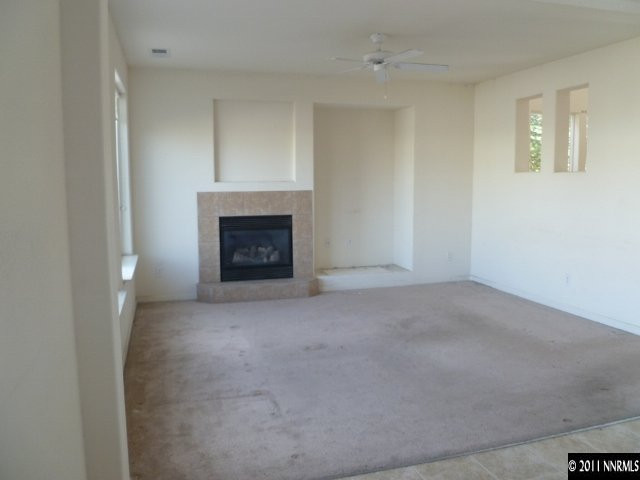 9265 Hummer Drive Reno, NV 89521 - Photo 5 of 13 a view of empty room with a fireplace