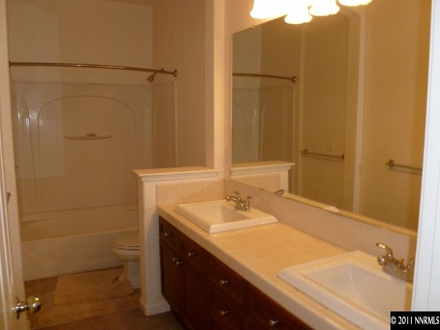 9265 Hummer Drive Reno, NV 89521 - Photo 10 of 13 a bathroom with a sink and a mirror