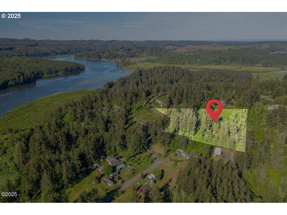 1600 Criteser Loop Toledo, OR 97391 - Photo 10 of 12 a view of a lake with a yard
