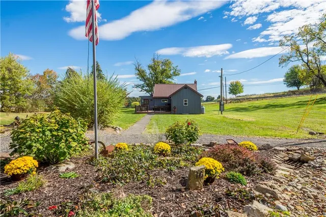 a view of a house with a garden