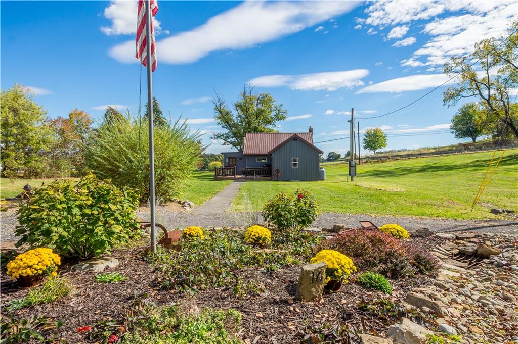 a view of a house with a garden