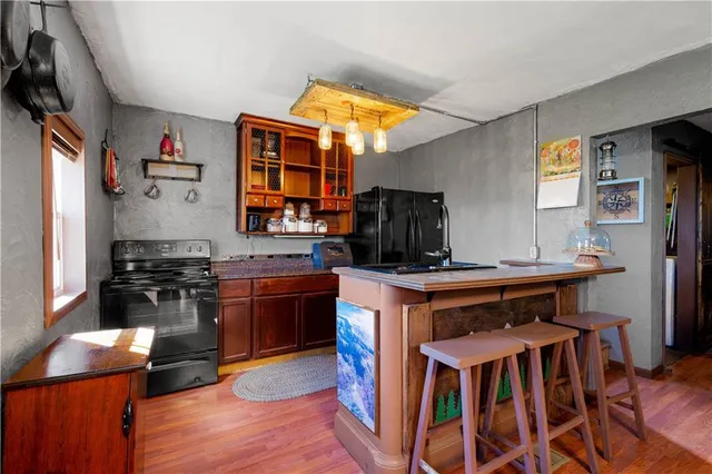 a kitchen with stainless steel appliances a stove and a refrigerator