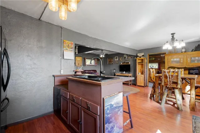 a kitchen with stainless steel appliances granite countertop a stove and a refrigerator