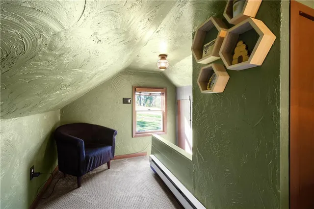 a living room with a couch and a window