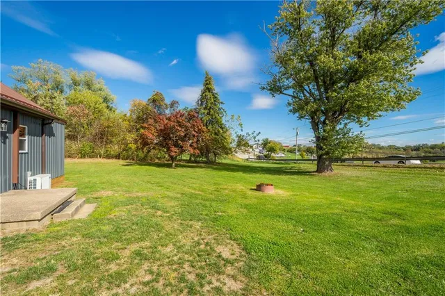 a view of a garden with a house