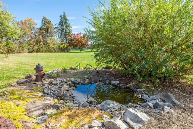 a view of a lake with a yard