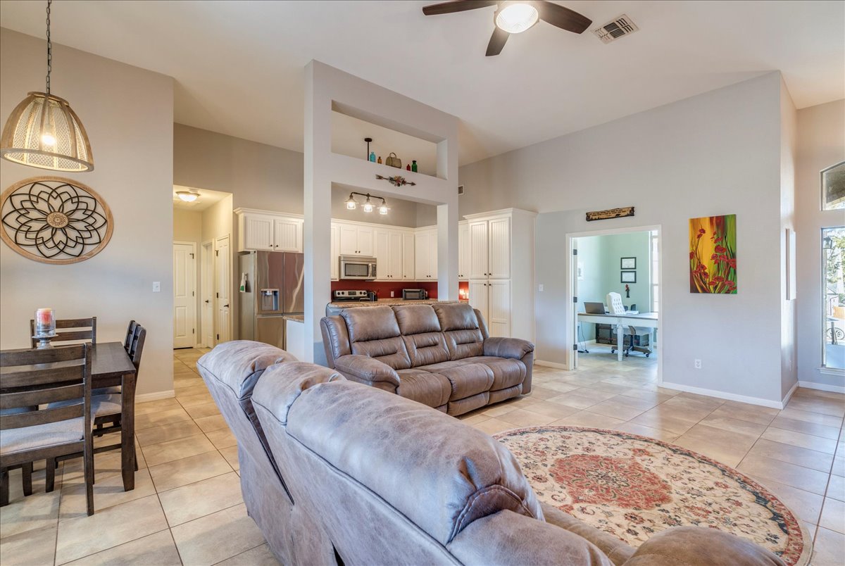 11 Rhapsody Lane Wimberley, TX 78676 - Photo 7 of 35 a living room with furniture and a chandelier