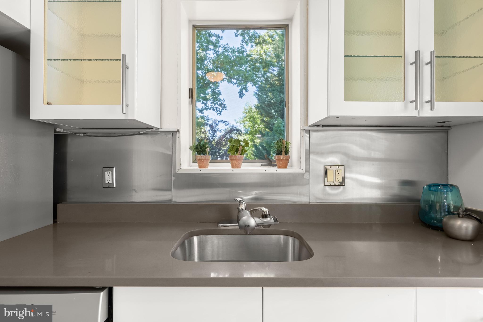 8800 Maywood Avenue Silver Spring, MD 20910 - Photo 15 of 41 a kitchen with a sink and a window