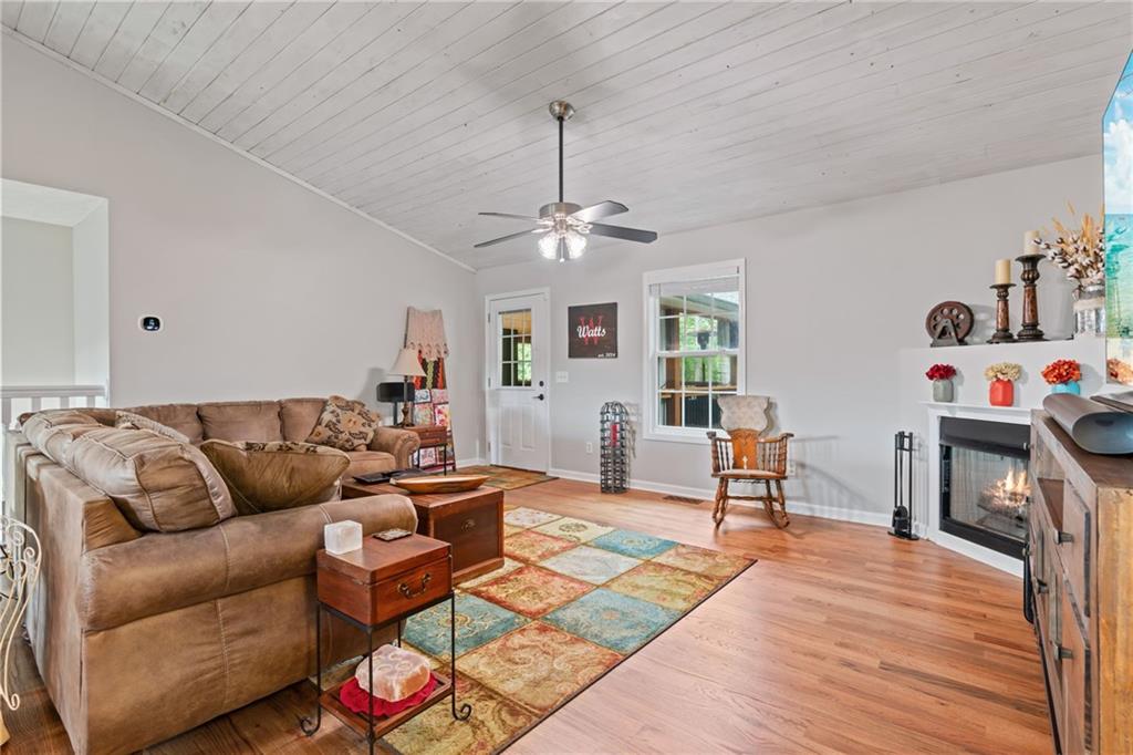 86 Back Trail Cleveland, GA 30528 - Photo 11 of 53 a living room with furniture flat screen tv and a window