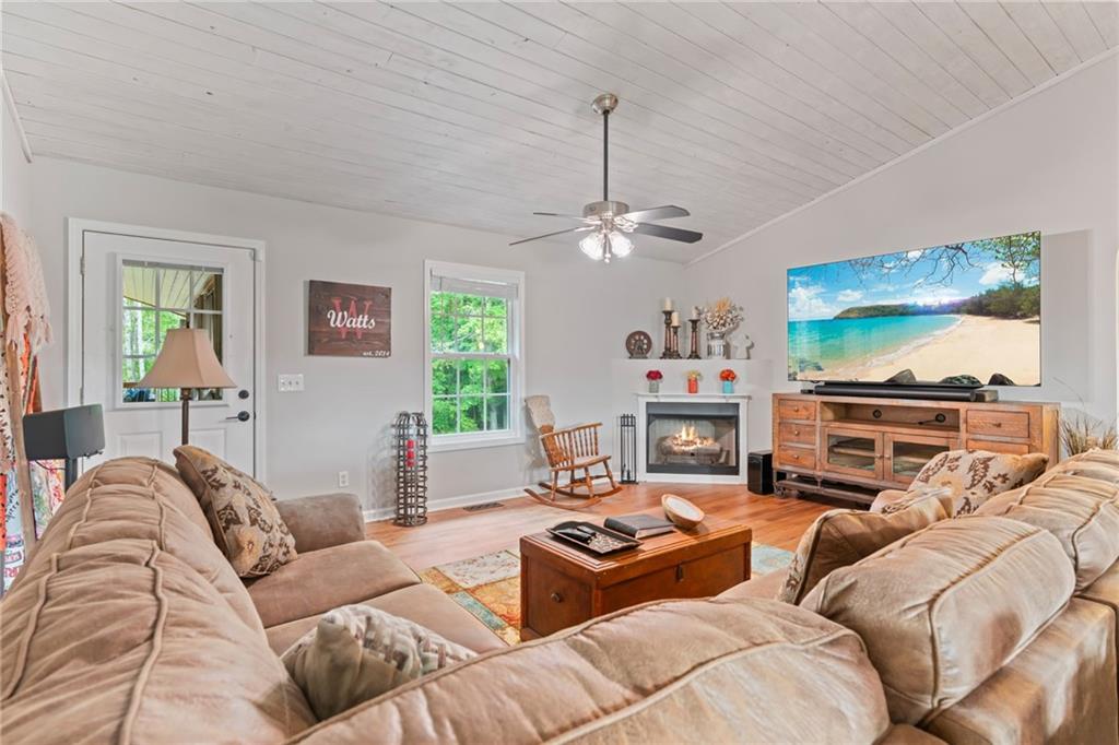 86 Back Trail Cleveland, GA 30528 - Photo 12 of 53 a living room with furniture and a flat screen tv