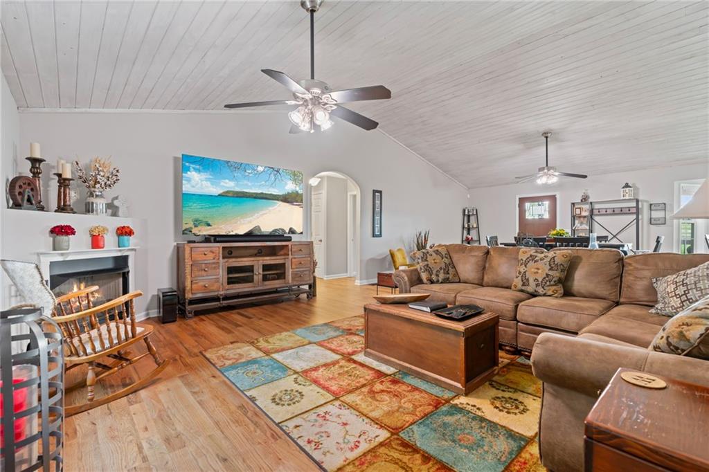 86 Back Trail Cleveland, GA 30528 - Photo 13 of 53 a living room with furniture a fireplace and a flat screen tv