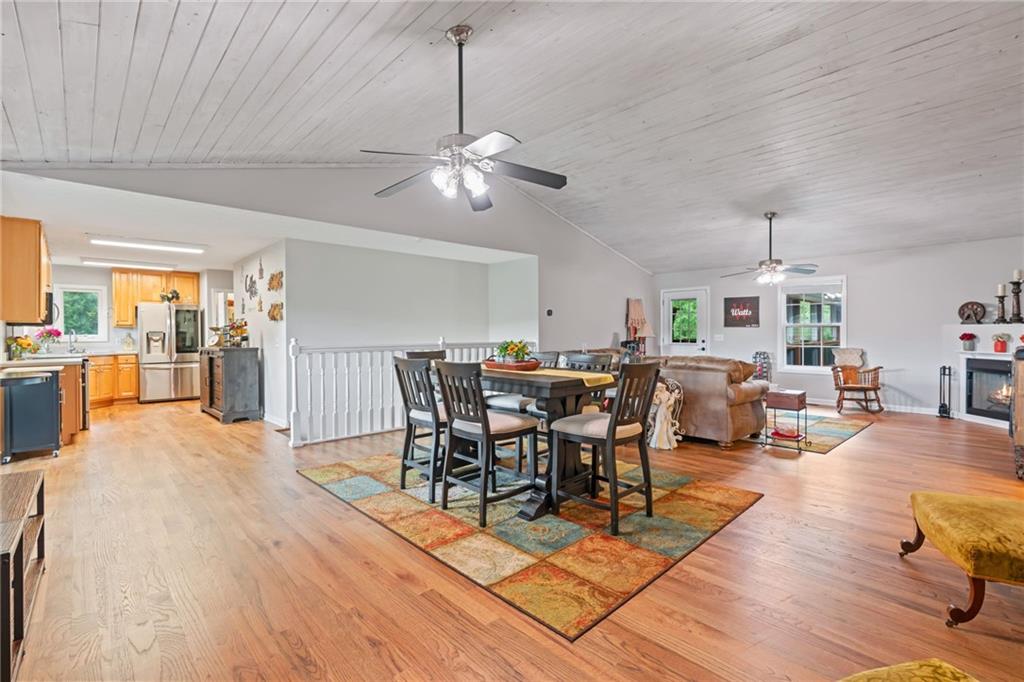 86 Back Trail Cleveland, GA 30528 - Photo 15 of 53 a view of a dining room and livingroom with furniture wooden floor a chandelier
