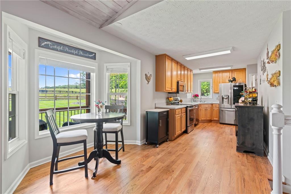 86 Back Trail Cleveland, GA 30528 - Photo 16 of 53 a view of a dining room with furniture window and wooden floor