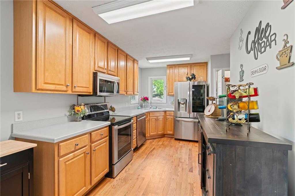86 Back Trail Cleveland, GA 30528 - Photo 17 of 53 a kitchen with a sink appliances cabinets and furniture