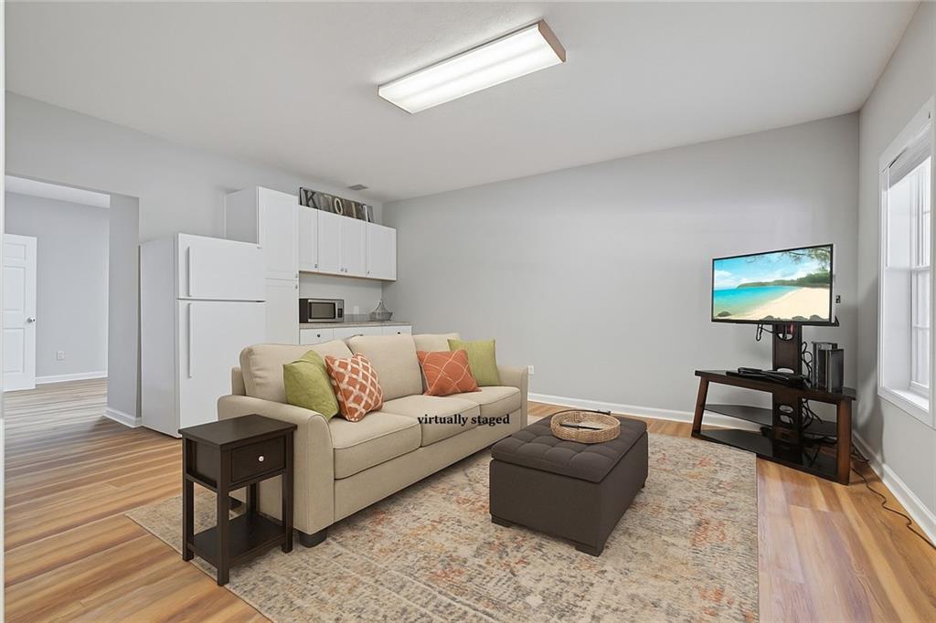 86 Back Trail Cleveland, GA 30528 - Photo 26 of 53 a living room with furniture and a wooden floor