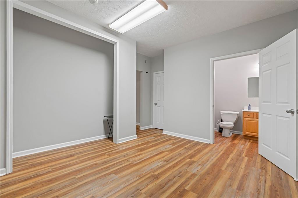 86 Back Trail Cleveland, GA 30528 - Photo 29 of 53 a view of a room with wooden floor and a sink