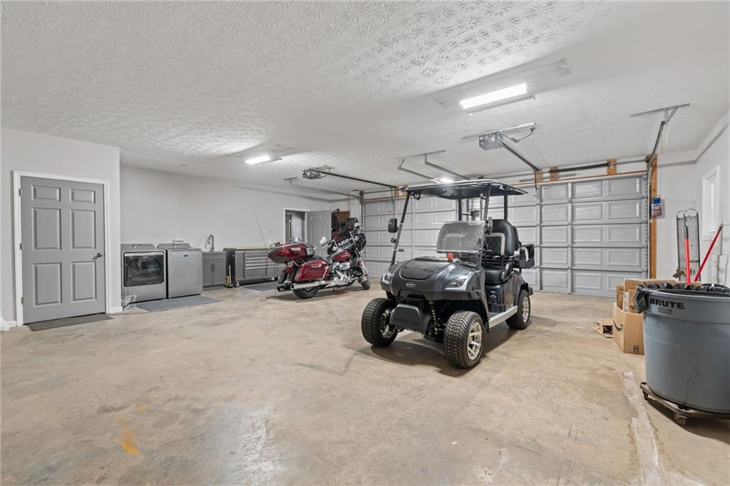 86 Back Trail Cleveland, GA 30528 - Photo 31 of 53 a view of a garage with furniture and cars in it