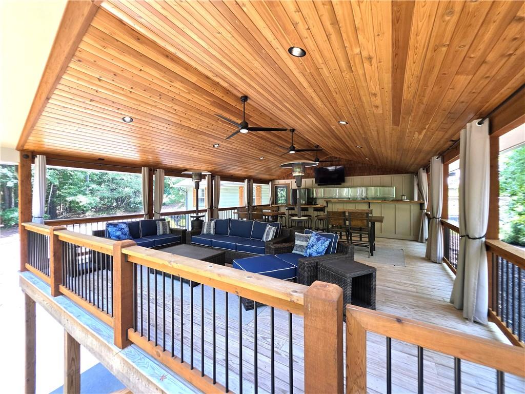 86 Back Trail Cleveland, GA 30528 - Photo 33 of 53 a view of a patio with chairs and wooden floor