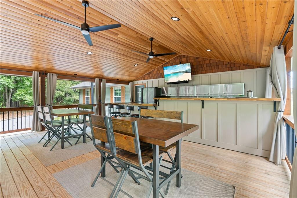86 Back Trail Cleveland, GA 30528 - Photo 37 of 53 a view of a patio with table and chairs and potted plants