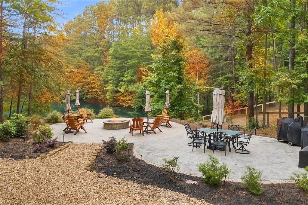 86 Back Trail Cleveland, GA 30528 - Photo 41 of 53 an outdoor sitting area with couch and chairs
