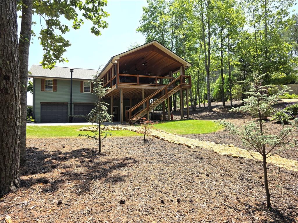 86 Back Trail Cleveland, GA 30528 - Photo 47 of 53 a view of a house with backyard and sitting area