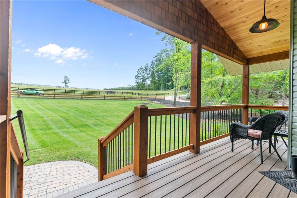 86 Back Trail Cleveland, GA 30528 - Photo 6 of 53 a view of a deck with a table and chairs next to a yard