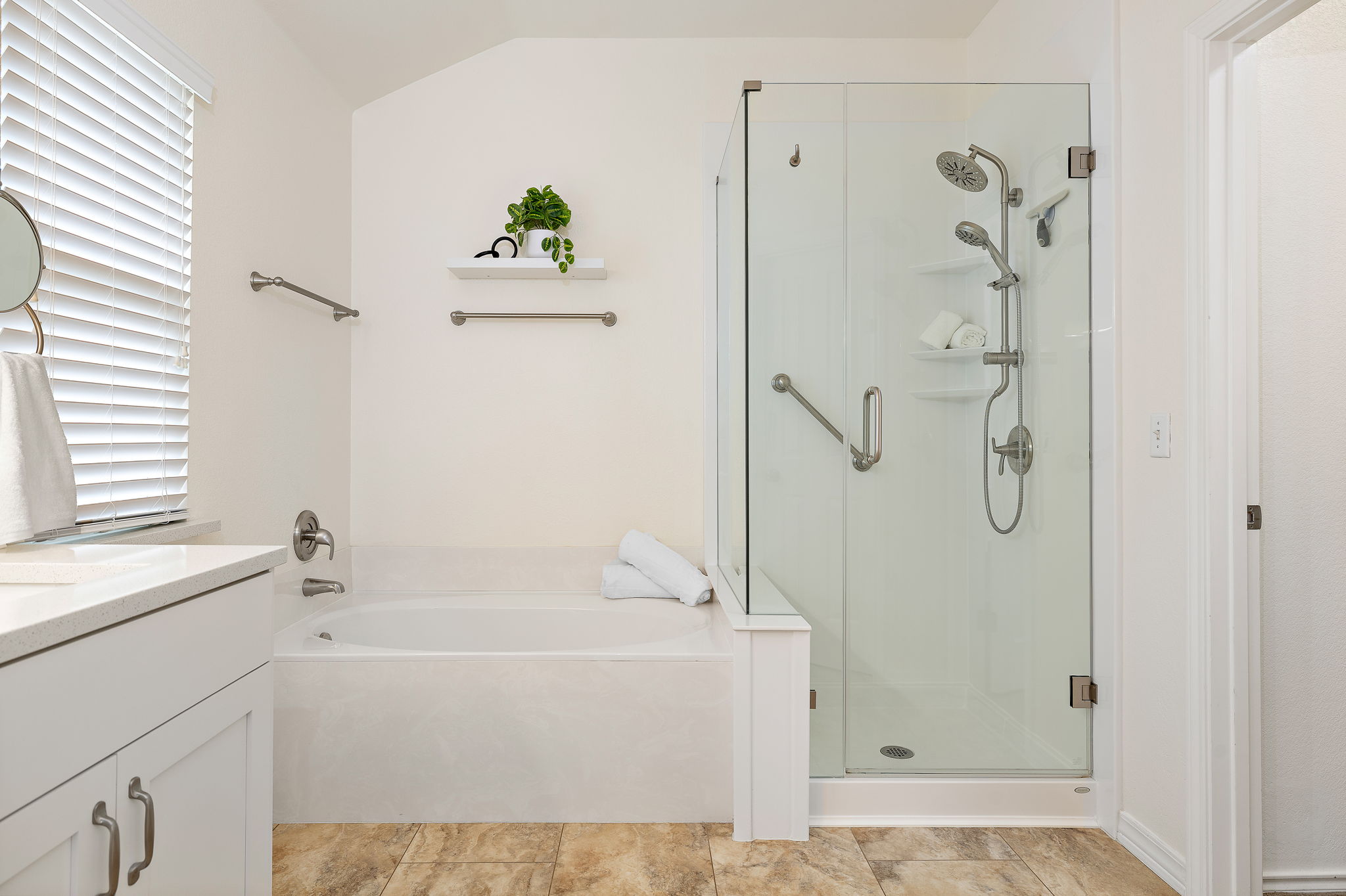 2201 Kerr Trail Cedar Park, TX 78613 - Photo 20 of 32 Remodeled primary bathroom features a soaking tub and a frameless walk-in shower