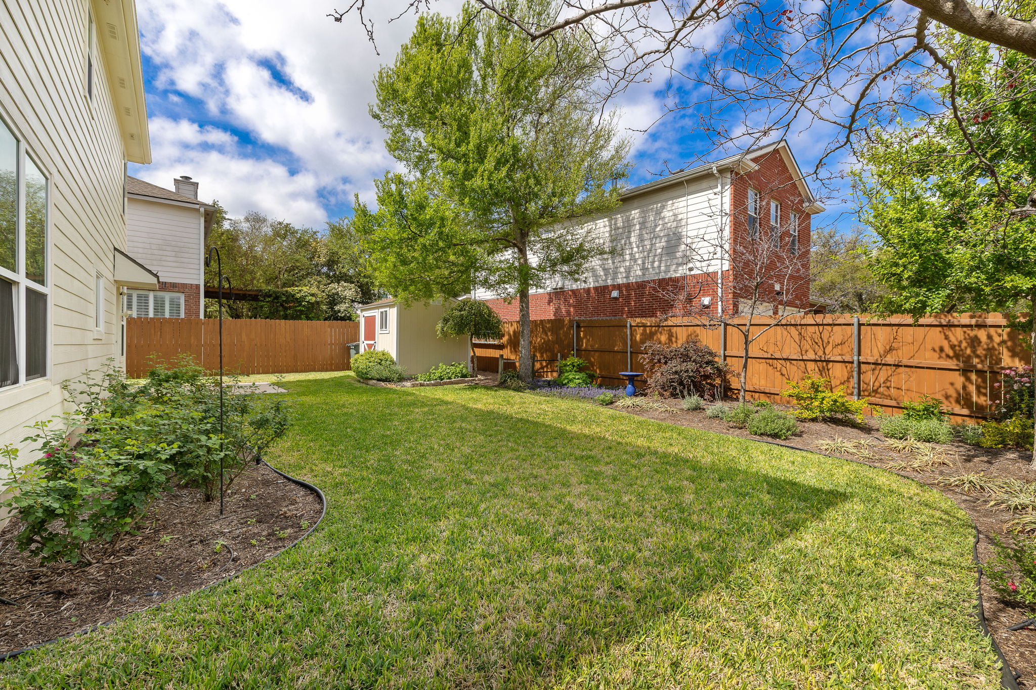 2201 Kerr Trail Cedar Park, TX 78613 - Photo 29 of 32 Backyard is fully fenced in with a wooden fence with metal posts