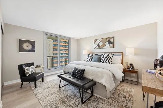 a bedroom with a bed and a window