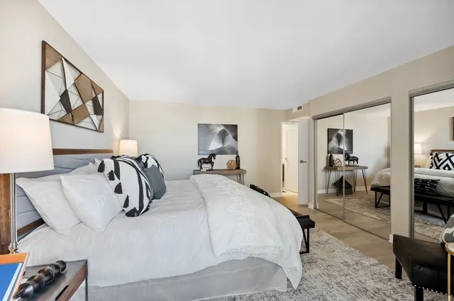 a bedroom with a bed and couch