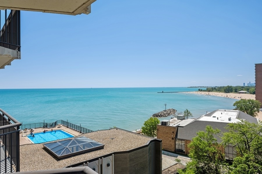 6007 North Sheridan Road, Unit 7J Chicago, IL 60660 - Photo 22 of 25 an outdoor space with furniture and a lake view