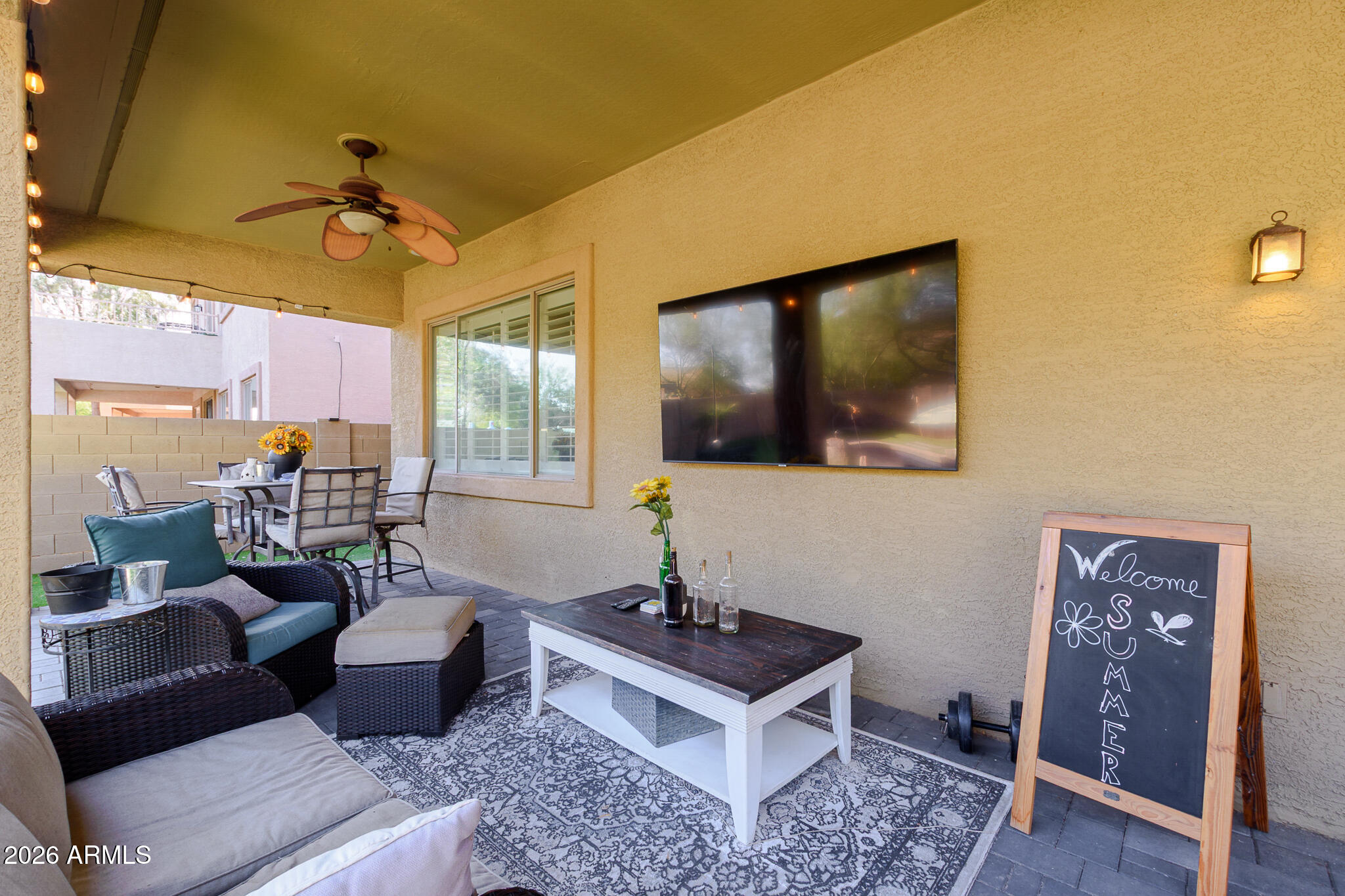 4521 West Moss Springs Road Anthem, AZ 85086 - Photo 5 of 35 a living room with furniture and a flat screen tv
