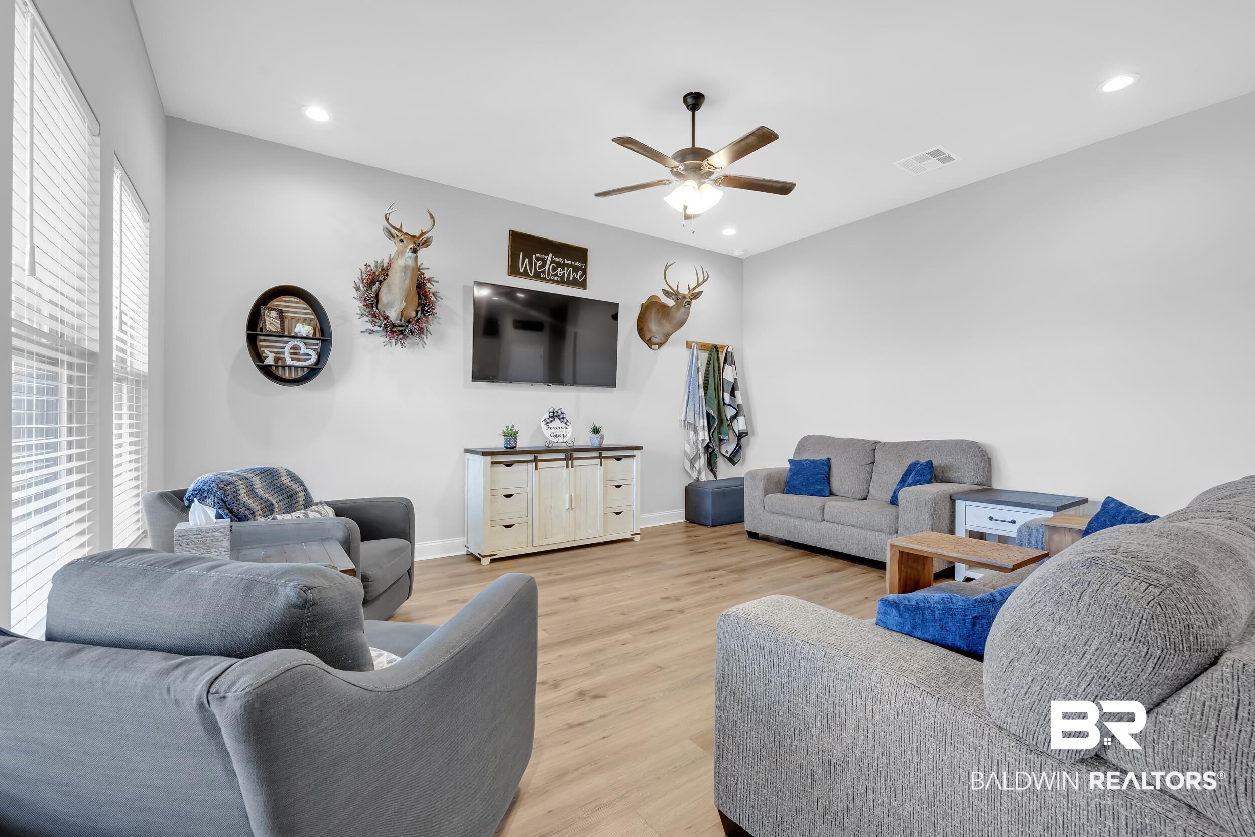 1176 Stella Road Foley, AL 36535 - Photo 9 of 40 Living area featuring wood finished floors, ceiling fan, and recessed lighting