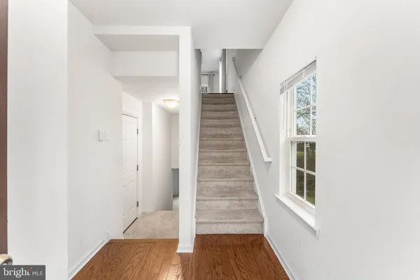 a view of entryway with wooden floor