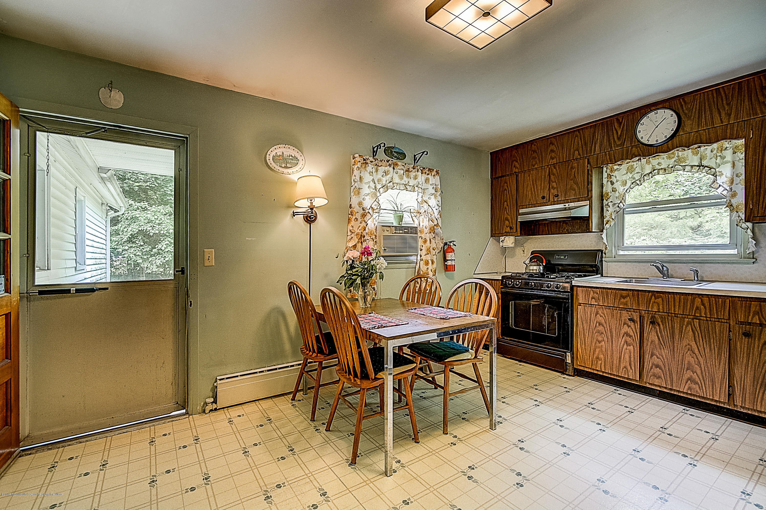 137 Pond Road Freehold, NJ 07728 - Photo 12 of 52 a view of a dining room with furniture window and outside view