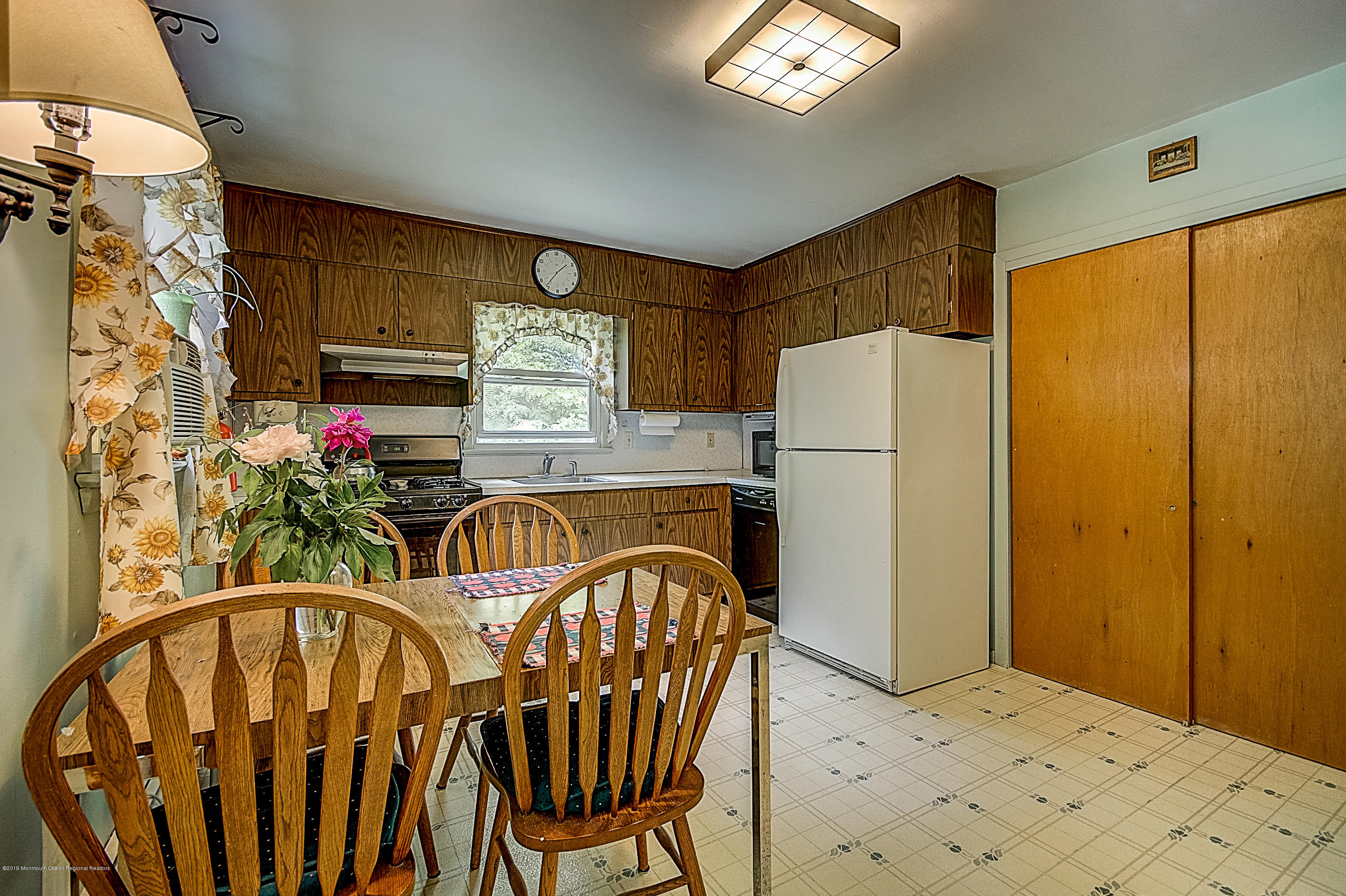137 Pond Road Freehold, NJ 07728 - Photo 14 of 52 a kitchen with stainless steel appliances granite countertop a refrigerator and a stove top oven
