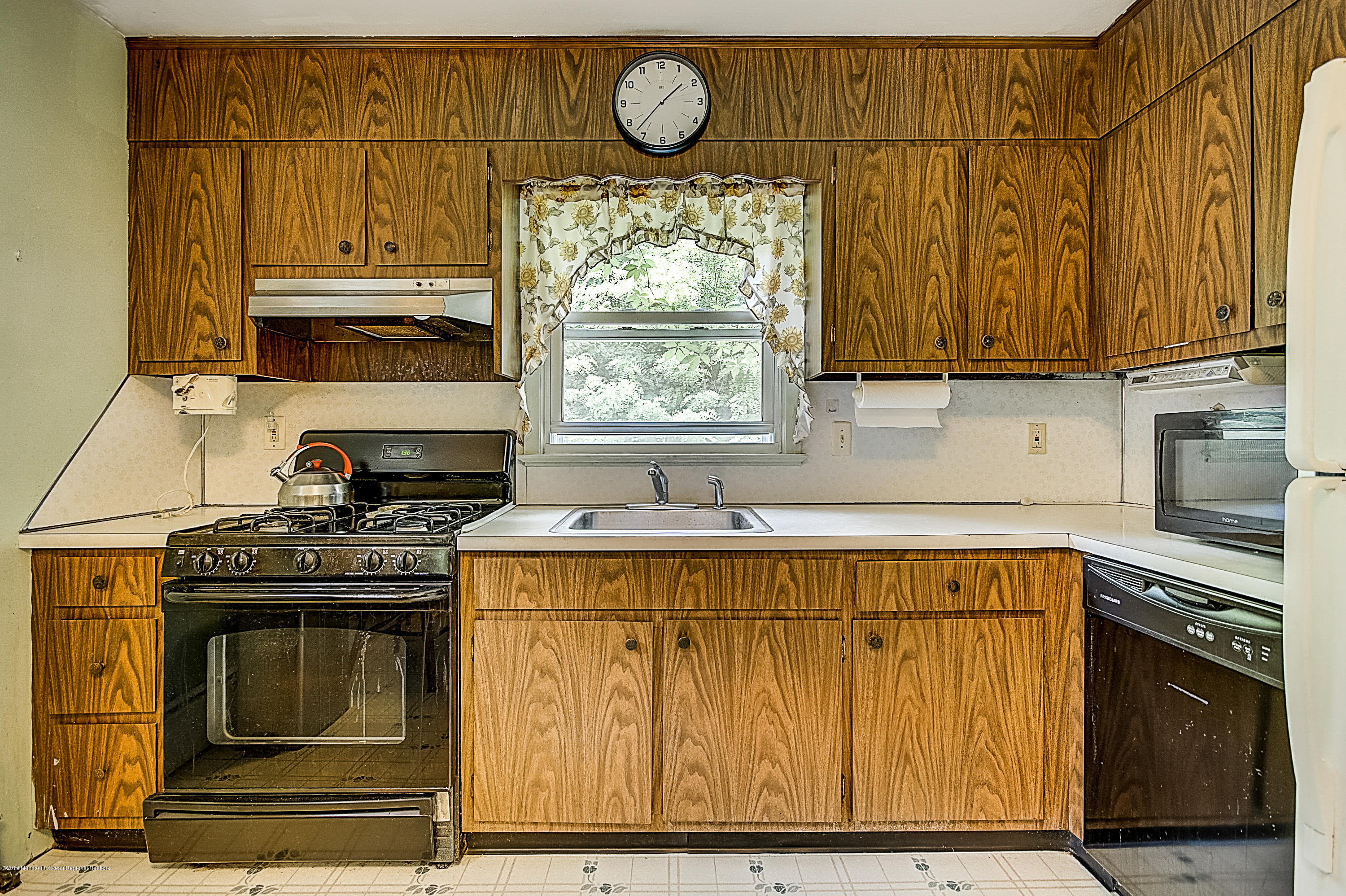 137 Pond Road Freehold, NJ 07728 - Photo 15 of 52 a kitchen with a stove and a sink