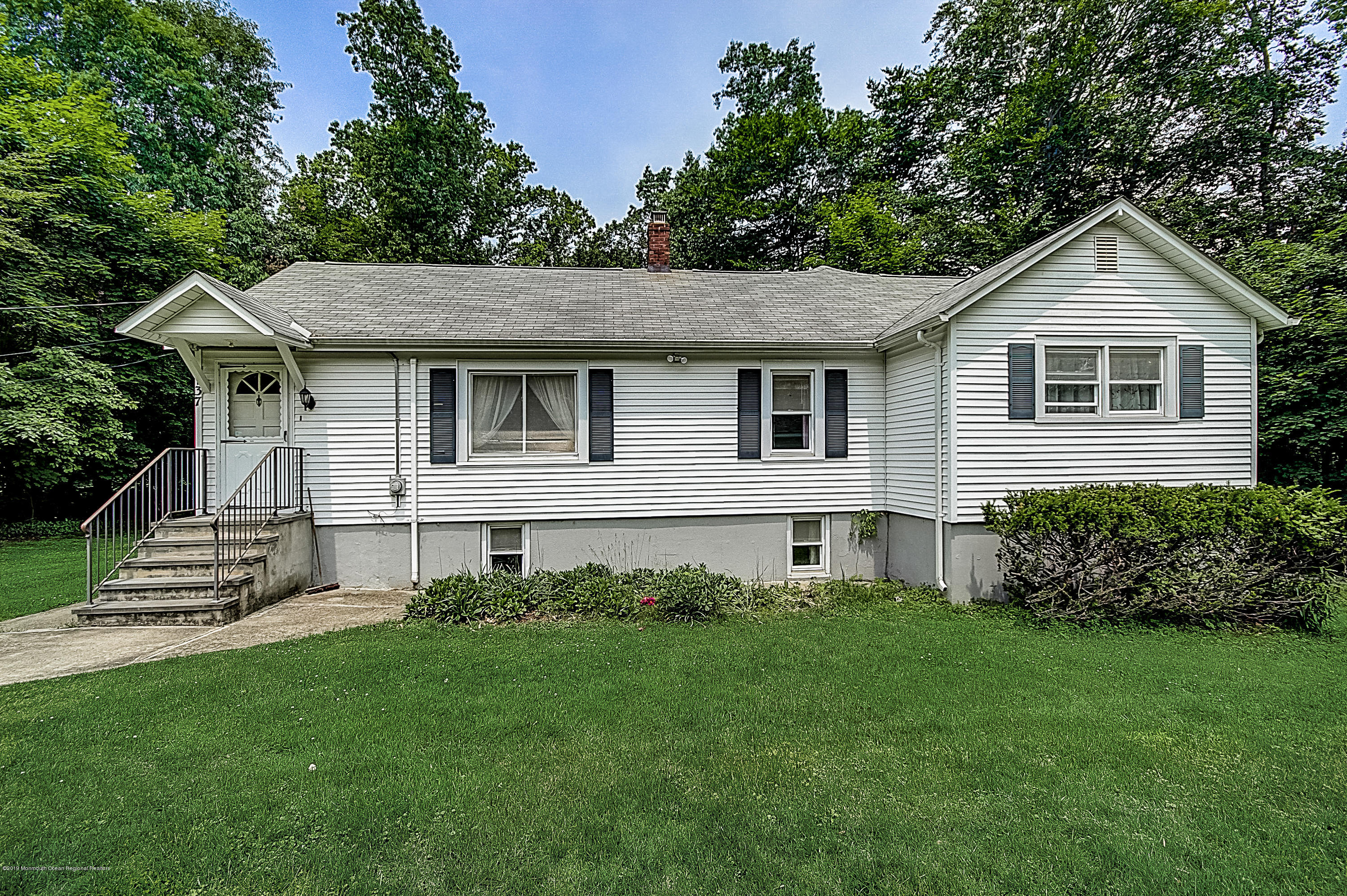 137 Pond Road Freehold, NJ 07728 - Photo 2 of 52 a front view of a house with a yard