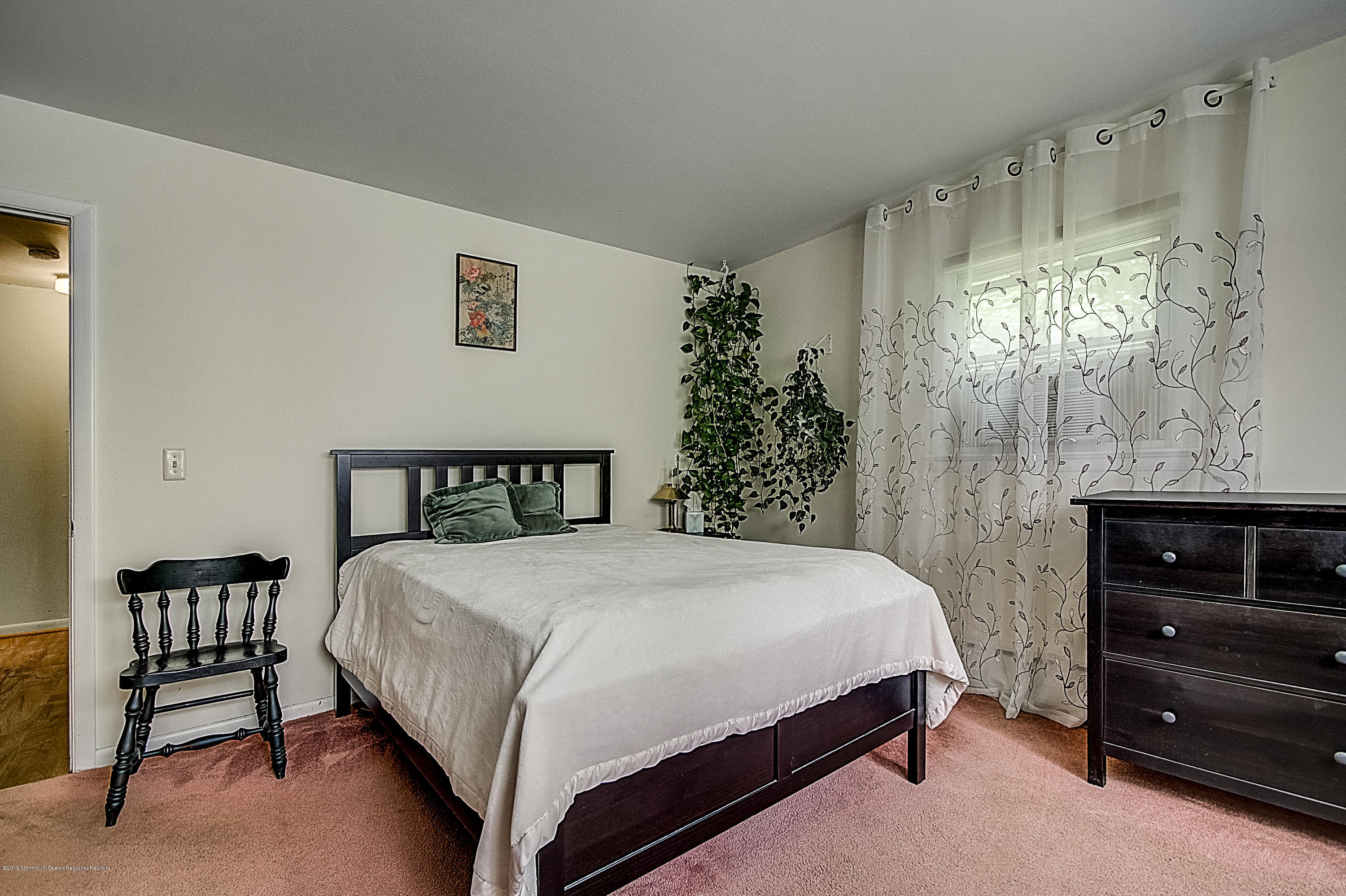 137 Pond Road Freehold, NJ 07728 - Photo 23 of 52 a bedroom with a bed and a window