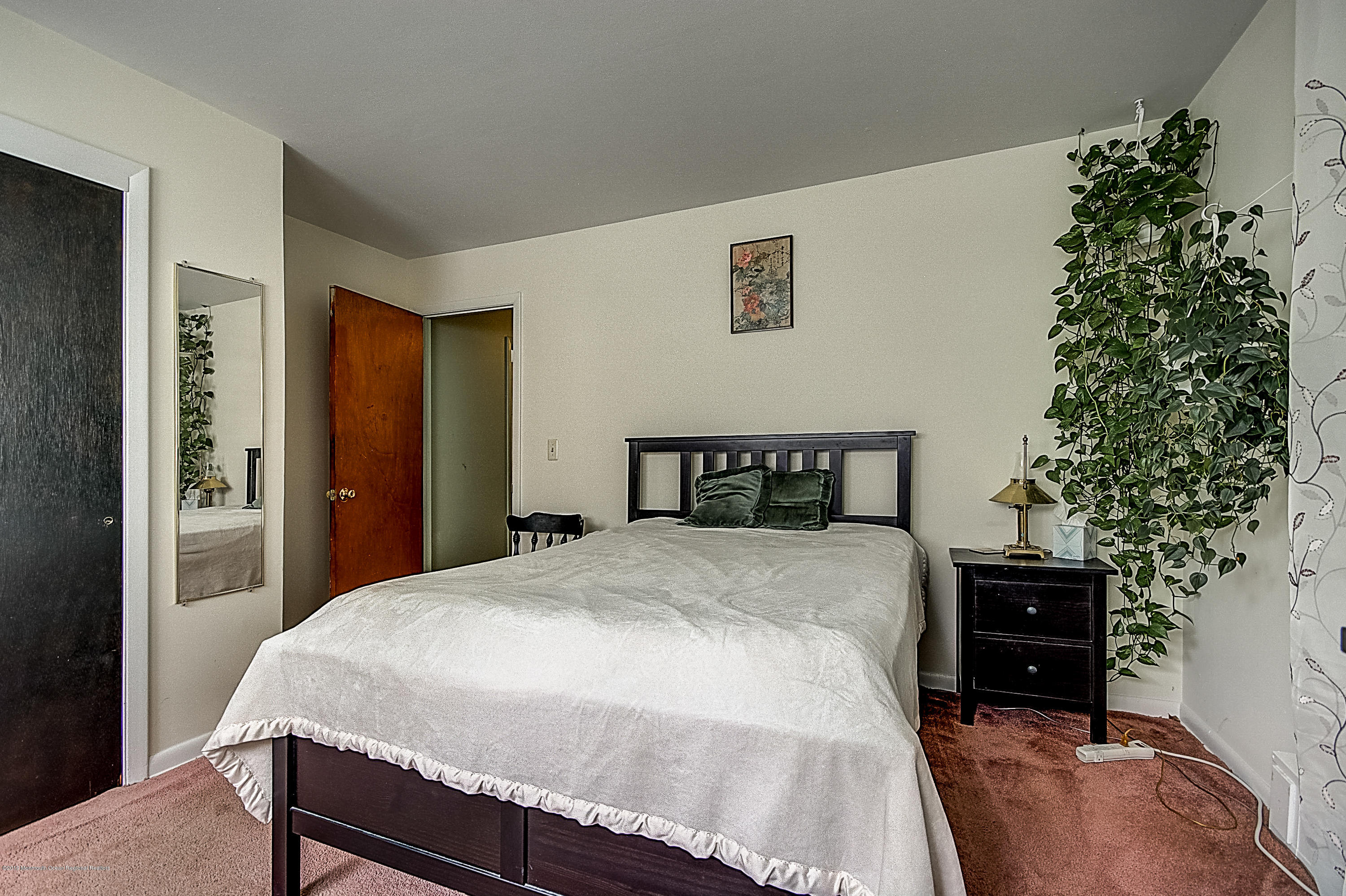 137 Pond Road Freehold, NJ 07728 - Photo 24 of 52 a bedroom with a bed and a tv