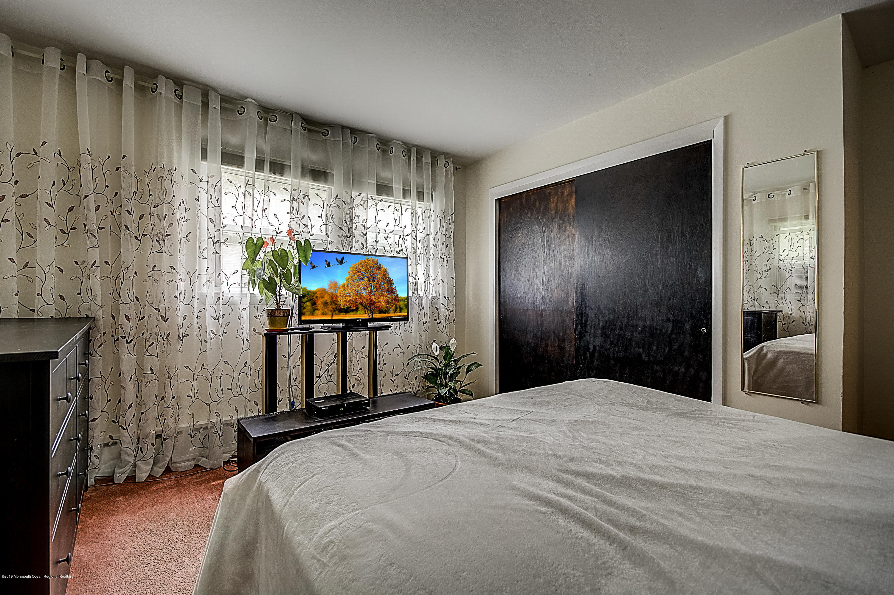 137 Pond Road Freehold, NJ 07728 - Photo 25 of 52 a bedroom with a bed and a window